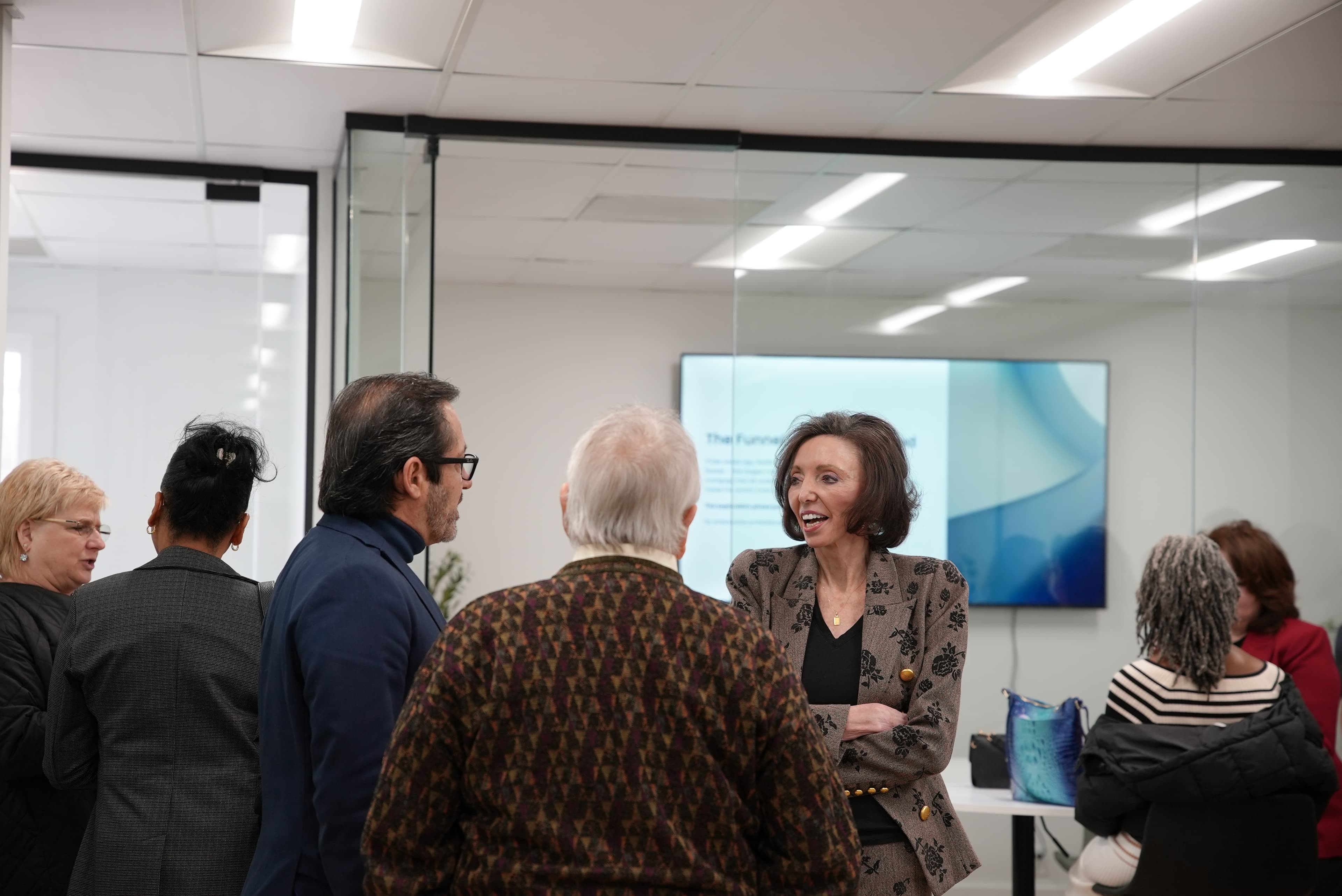Marti Hampton laughing with agents at the Culture Center