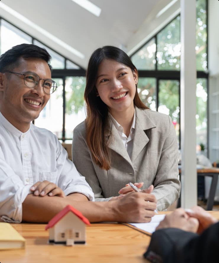 Clients reviewing loan paperwork with a Success Lending advisor